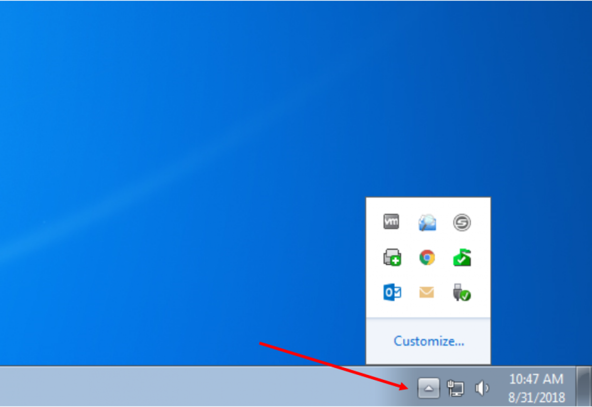 Image of desktop with arrow pointing to taskbar